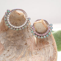 Opalite peach and clear CZ titanium clicker body jewelry, 16g, with an 8mm diameter for body piercing.
