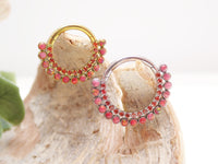 Red fire opal and CZ titanium clicker jewelry in 16g size, featuring a sleek body clicker design with vibrant gemstones.