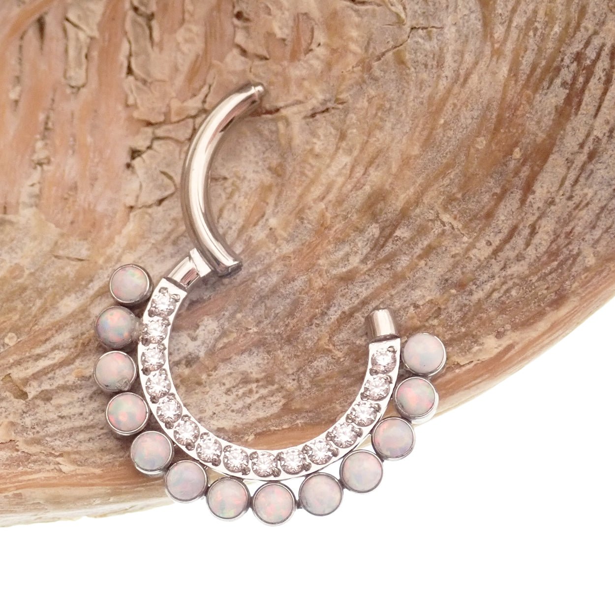 White opal and clear CZ titanium clicker earring in 16g size, featuring an 8mm decorative design for body piercing.