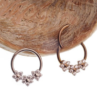 Flower Titanium Hinged 10mm Clicker by Body Clickers, 16g, featuring a decorative floral design on a durable metal body.