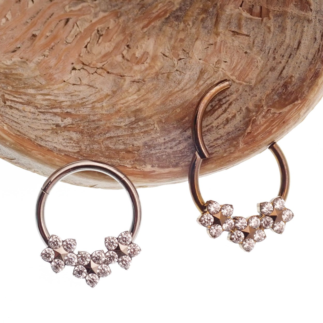Flower Titanium Hinged 10mm Clicker by Body Clickers, 16g, featuring a decorative floral design on a durable metal body.