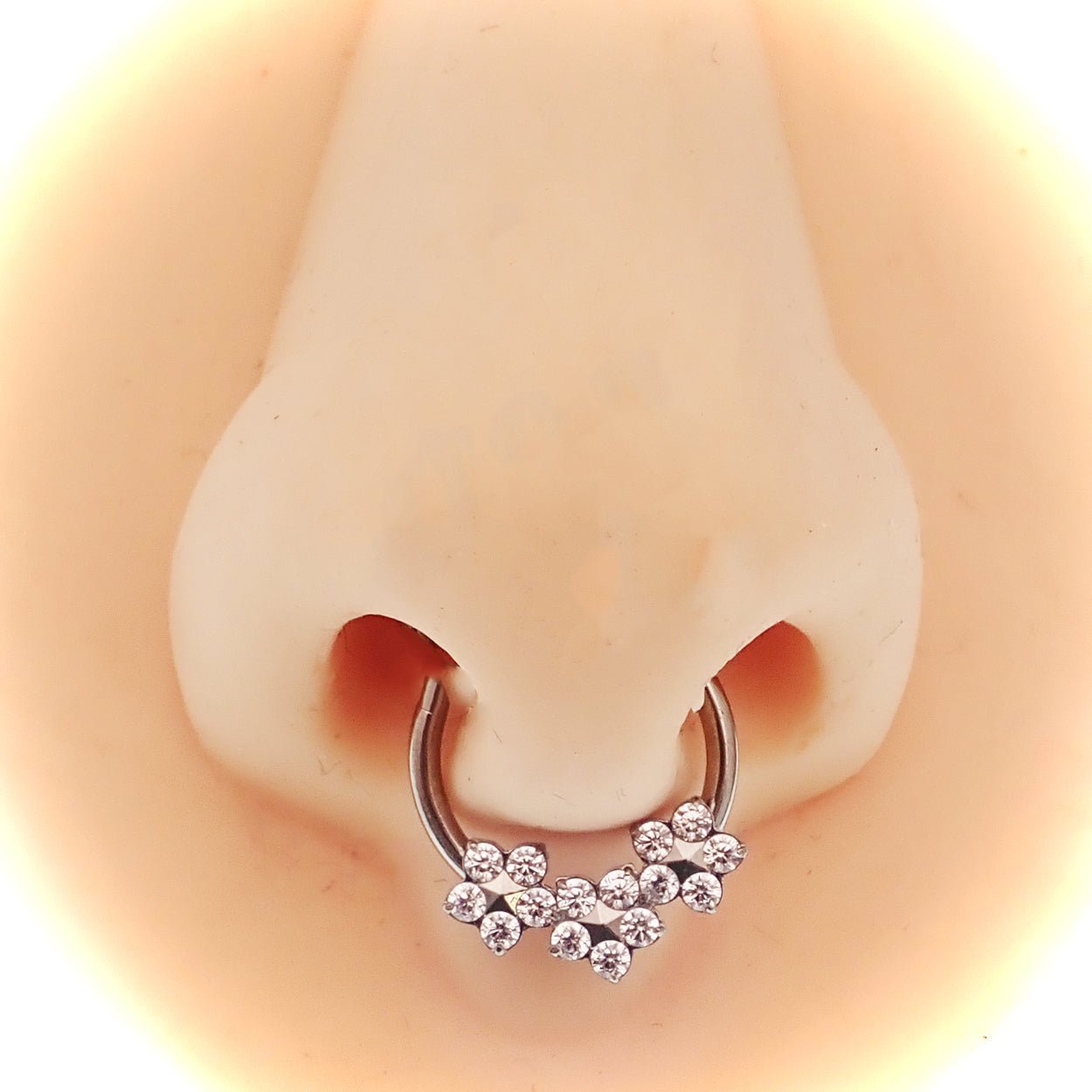 Flower titanium hinged clicker earring in 10mm size, 16g gauge, by Body Clickers, with detailed flower design and smooth hinge.