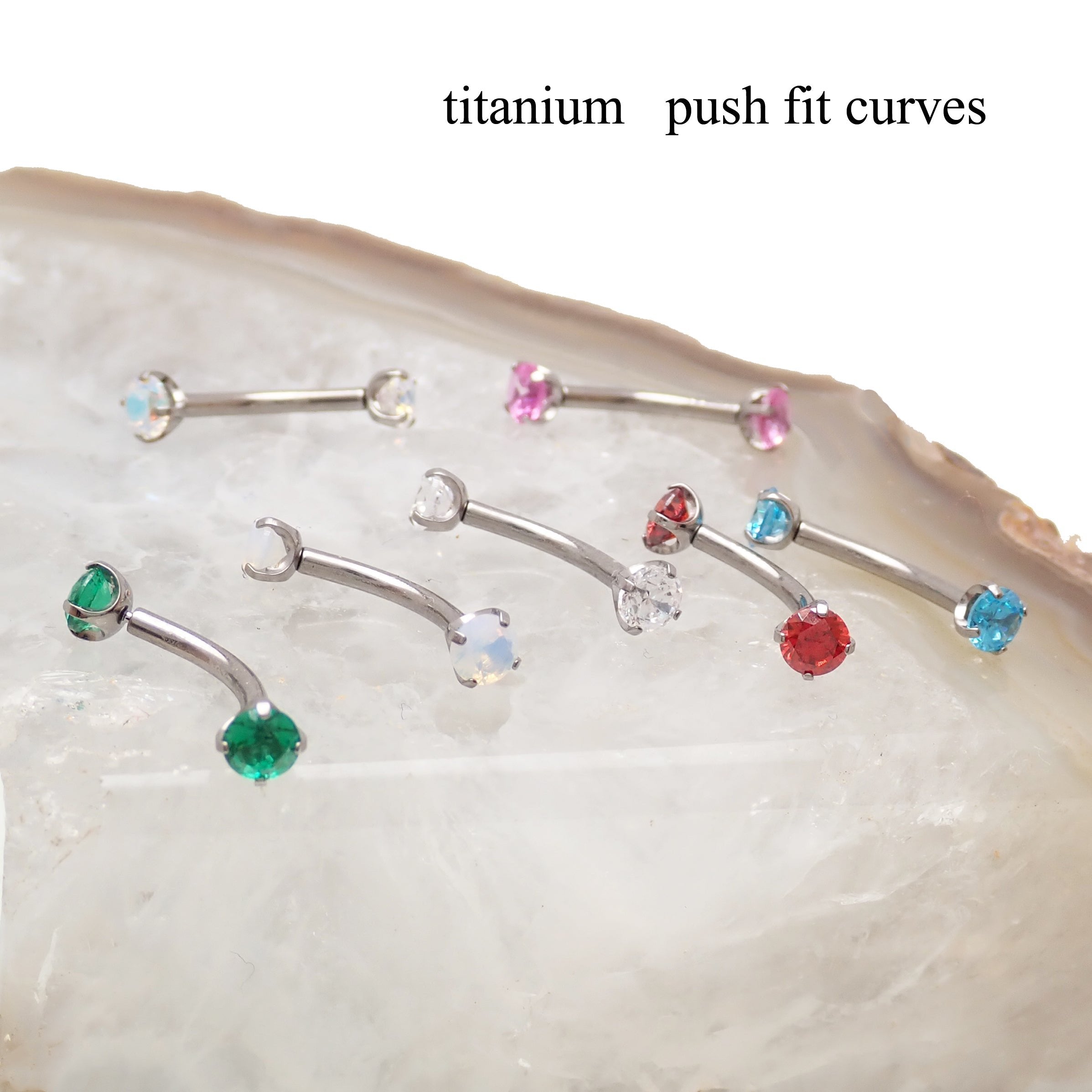Body Clickers titanium curve barbell with CZ push-fit design, available in 14g, 16g, and 18g with 3mm stones.