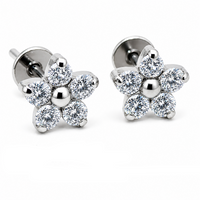 Titanium clear CZ flower earrings from Body Clickers, 20g implant jewelry with intricate flower design and sparkling stones.