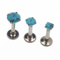Turquoise claw set stone internally threaded titanium flatback labret piercing earrings in 14g, 16g, and 18g sizes.