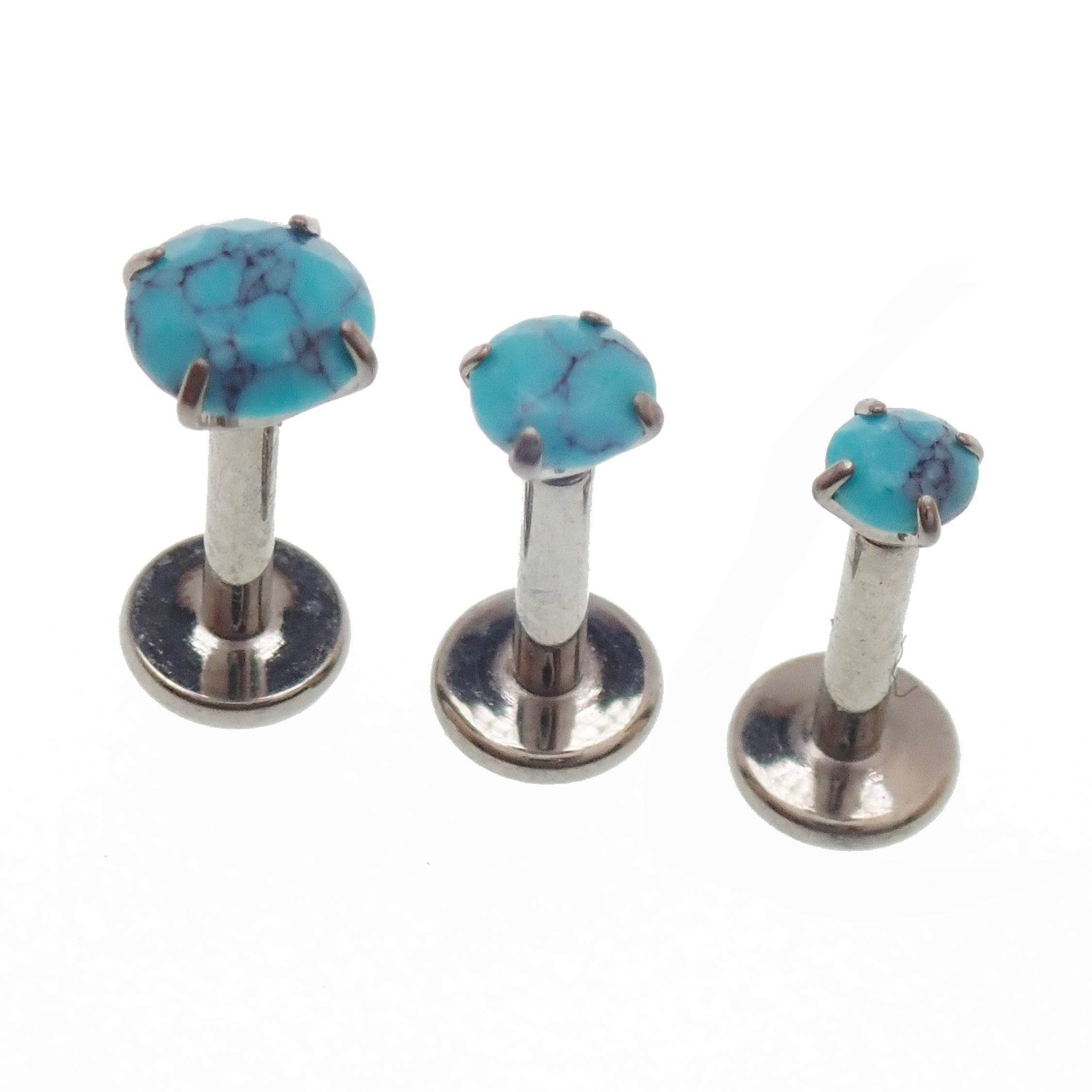 Turquoise claw set stone internally threaded titanium flatback labret piercing earrings in 14g, 16g, and 18g sizes.