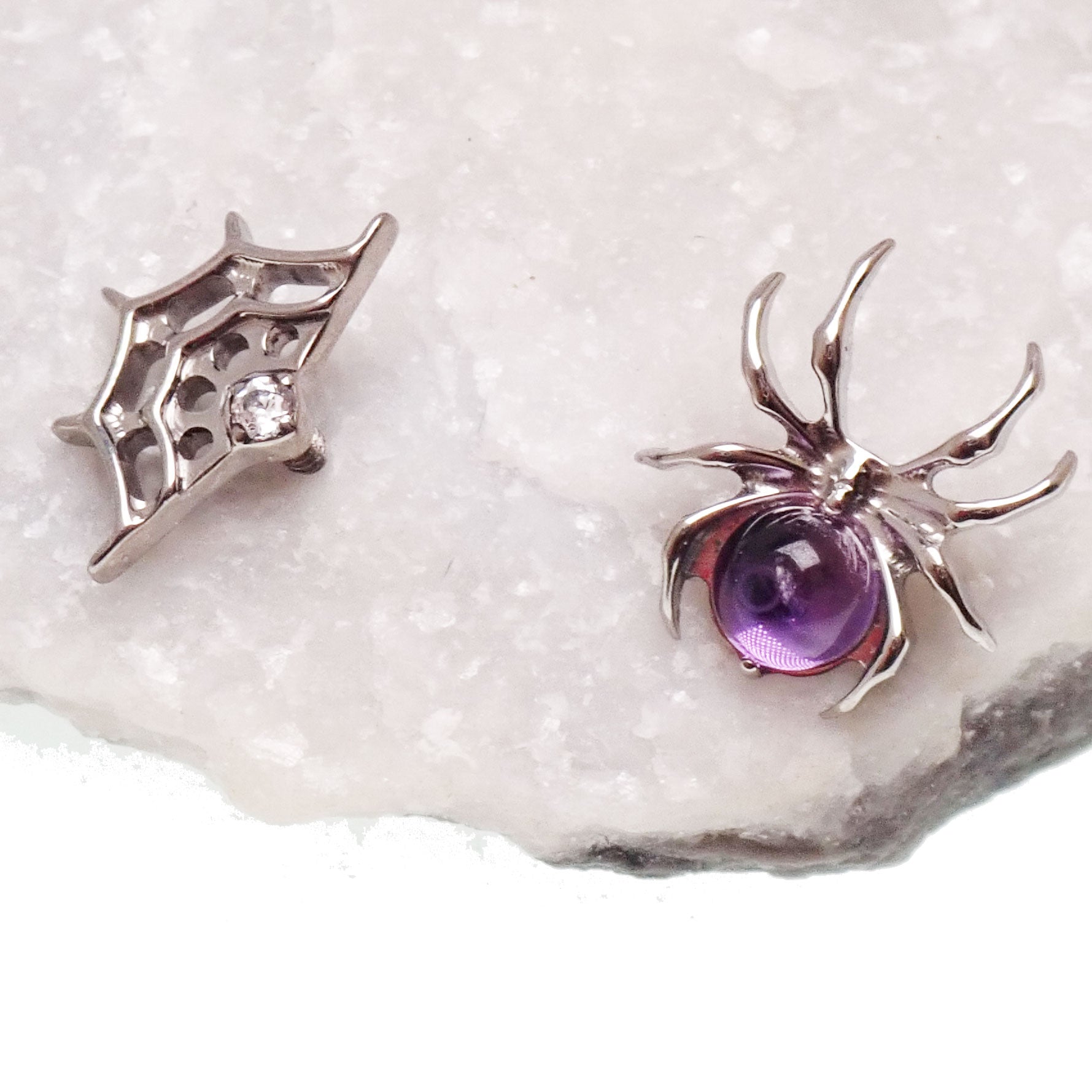 Internally threaded titanium Amethyst Spider & Web flatback earrings for piercings, 0.9mm thread, featuring purple gemstone design.