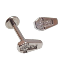 Titanium flatback labret piercing with coffin CZ cross design in 14g, 16g, 18g sizes, from Body Clickers.