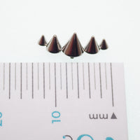 Titanium cone spike curve implant labret earrings, flatback, internally threaded, available in 14g, 16g, and 18g sizes.