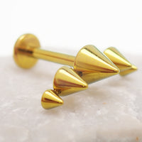 Titanium cone spike curve implant earrings with flatback labret, internally threaded in 14g, 16g, and 18g sizes.