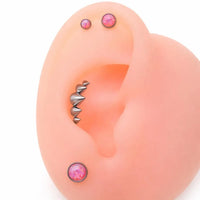 Titanium cone spike curve implant labret earrings with flatback, internally threaded in 14g, 16g, and 18g sizes.