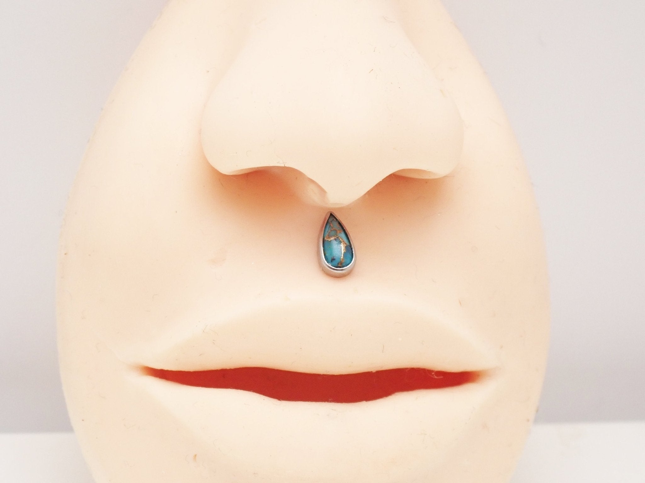 Copper turquoise flatback piercing earrings by Body Clickers, featuring tear-shaped turquoise and copper design for body jewelry.