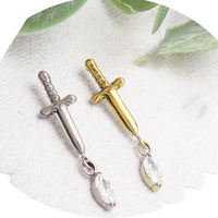 Titanium Dagger Flatback Piercing earrings in 14g, 16g, and 18g with a sleek dagger design from Body Clickers.