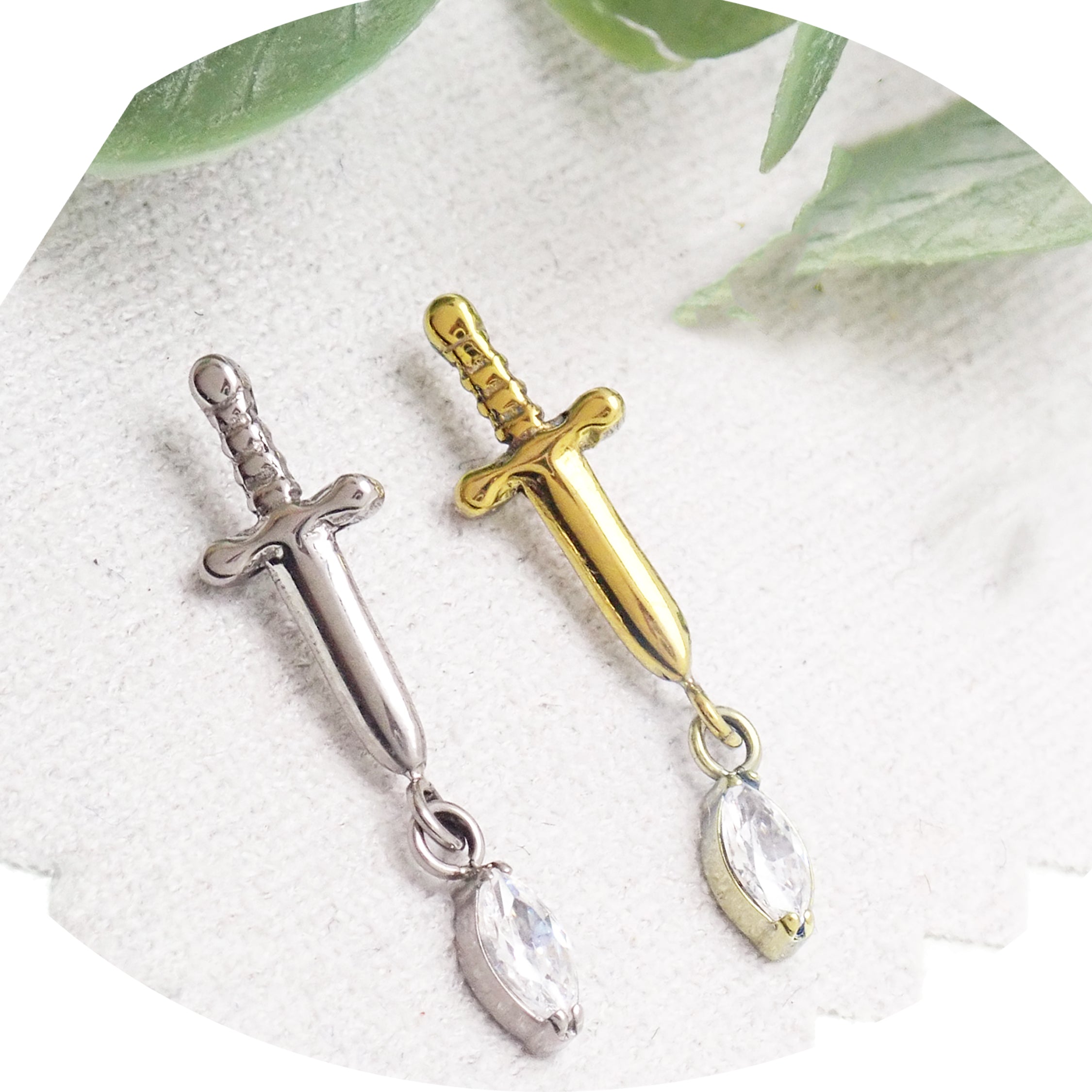 Titanium Dagger Flatback Piercing earrings in 14g, 16g, and 18g with a sleek dagger design from Body Clickers.