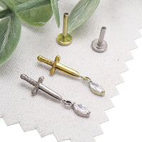 Body Clickers titanium dagger flatback earrings in 14g, 16g, and 18g with 6mm size, designed for pierced ears.
