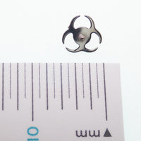 Titanium amethyst biohazard symbol flatback labret piercing earrings in 14g, 16g, and 18g with a sleek, eye-catching design.
