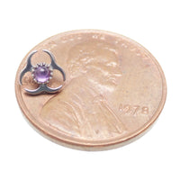 Titanium labret piercing with amethyst biohazard symbol, flatback design in 14g, 16g, and 18g sizes by Body Clickers.