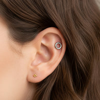 Body Clickers titanium circle flatback earrings, internally threaded, available in 14g, 16g, and 18g for ear piercings.