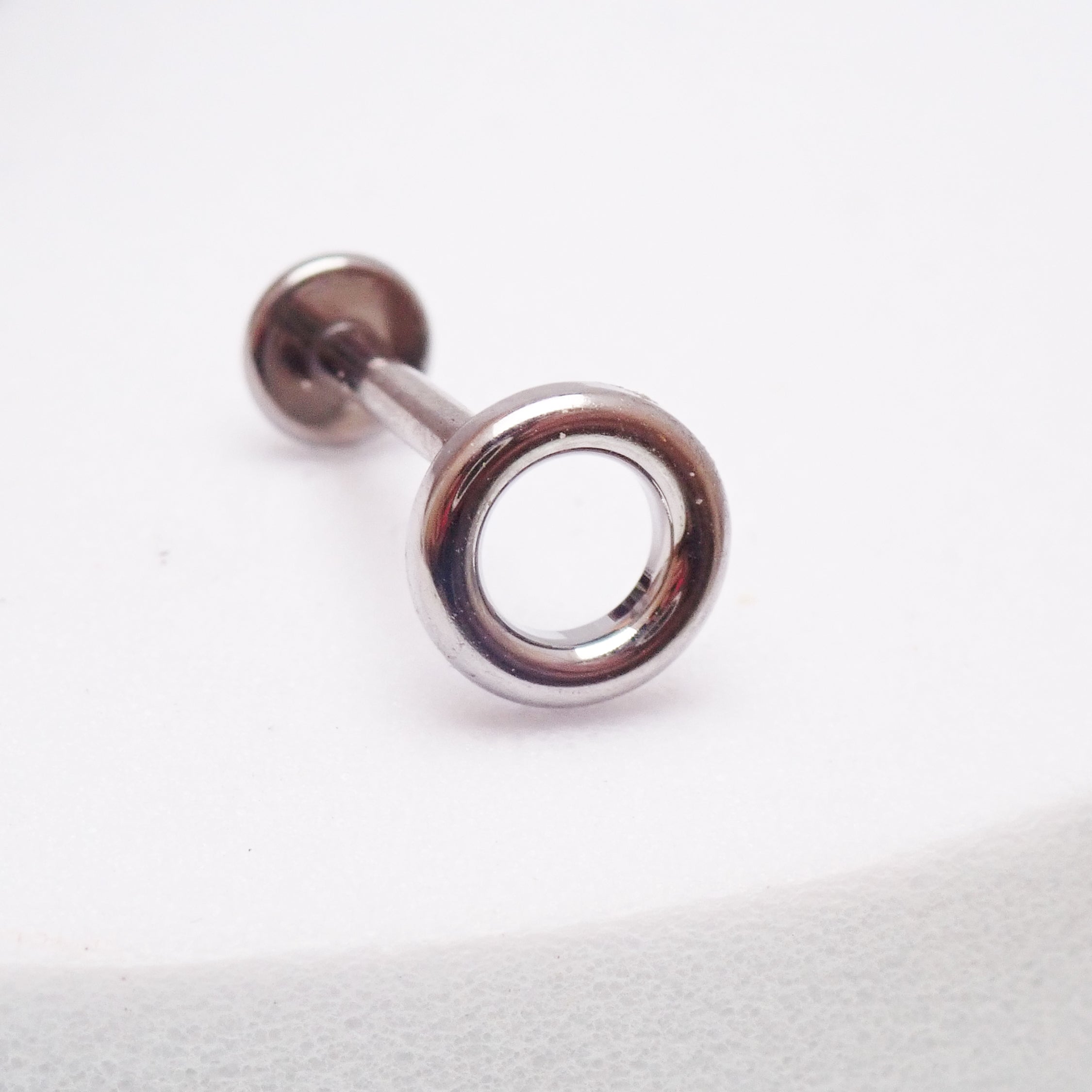 Body Clickers implant titanium circle flatback earrings, internally threaded in 14g, 16g, and 18g with 6mm diameter.