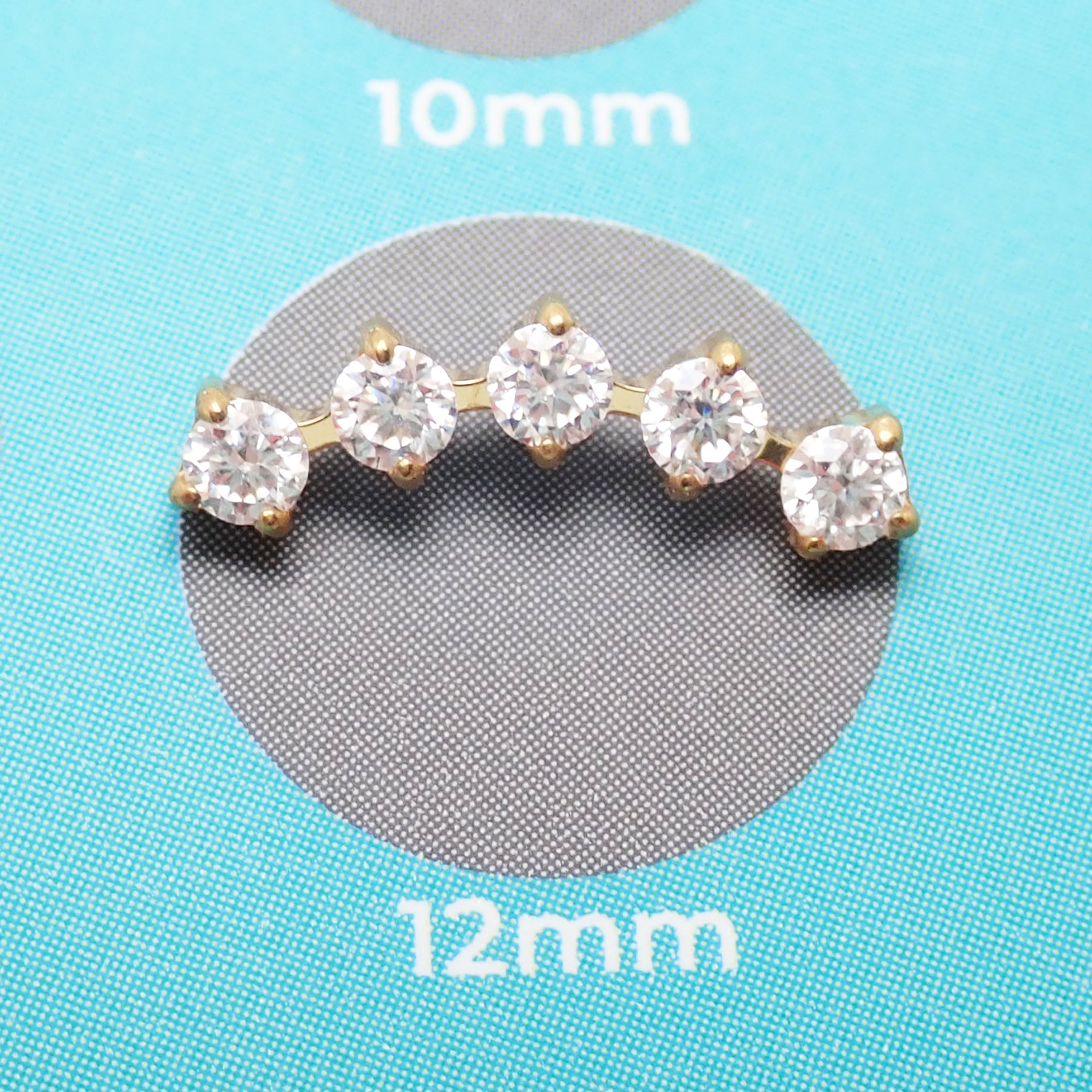 Body Clickers implant titanium curved labret earrings with cubic zirconia flatback in 14g, 16g, or 18g sizes, shown in the image.