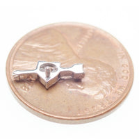 Titanium CZ arrow through a heart flatback labret piercing earring by Body Clickers, 18G, 6mm, with detailed heart and arrow design.