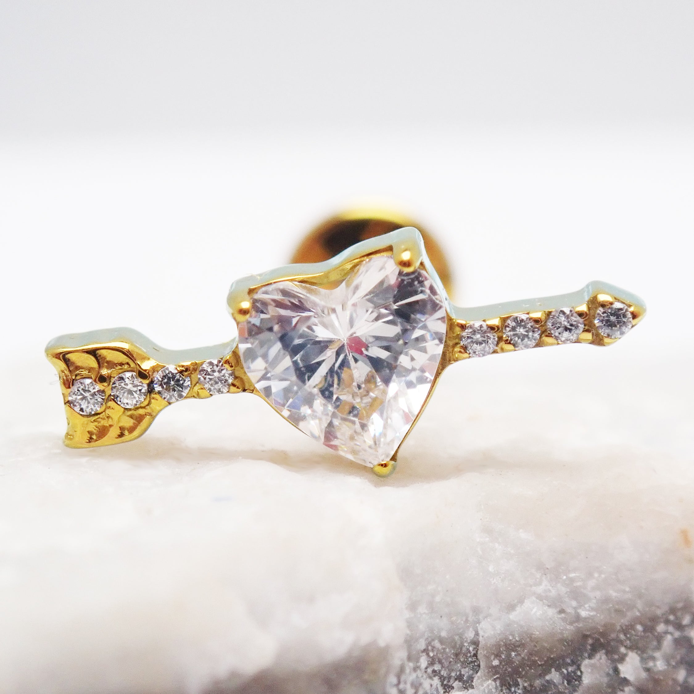 Titanium CZ arrow through a heart labret piercing earring by Body Clickers, 18G flatback jewelry for emotional expression.