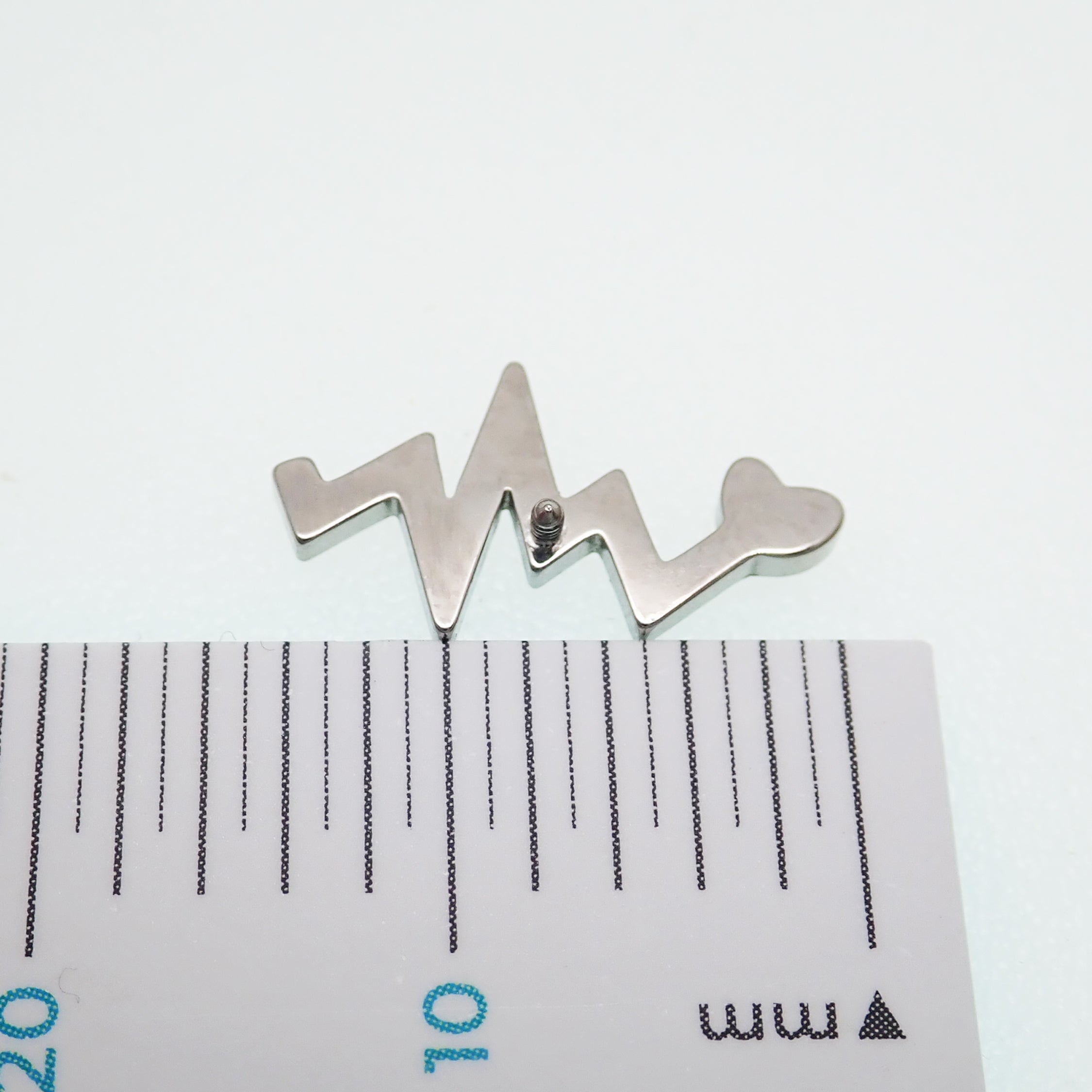 Titanium heartbeat flatback internally threaded labret piercing earrings in 14g, 16g, and 18g by Body Clickers