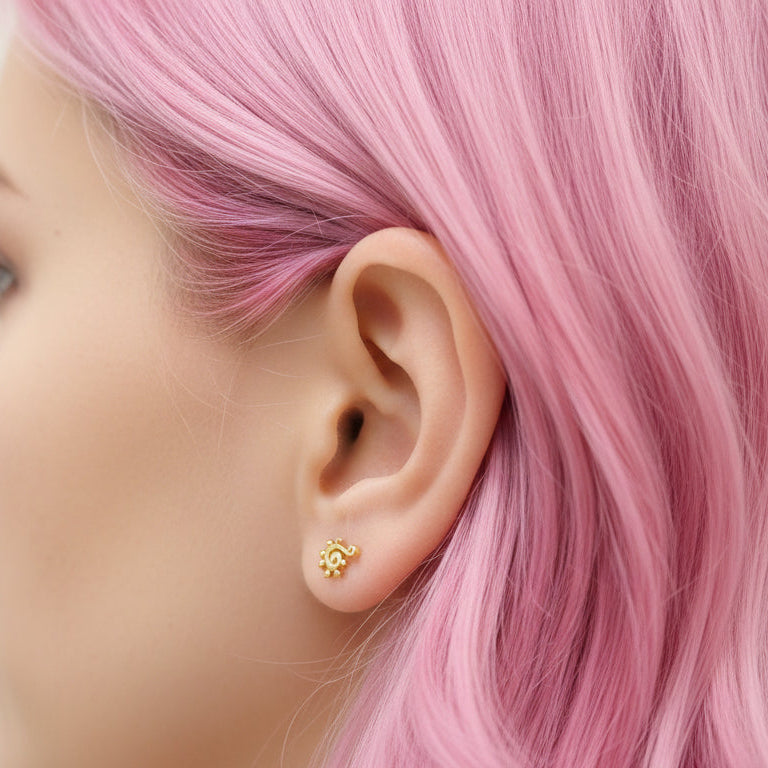 Body Clickers implant titanium PVD beaded swirl flatback labret earrings in 14g, 16g, and 18g with beaded swirl design.