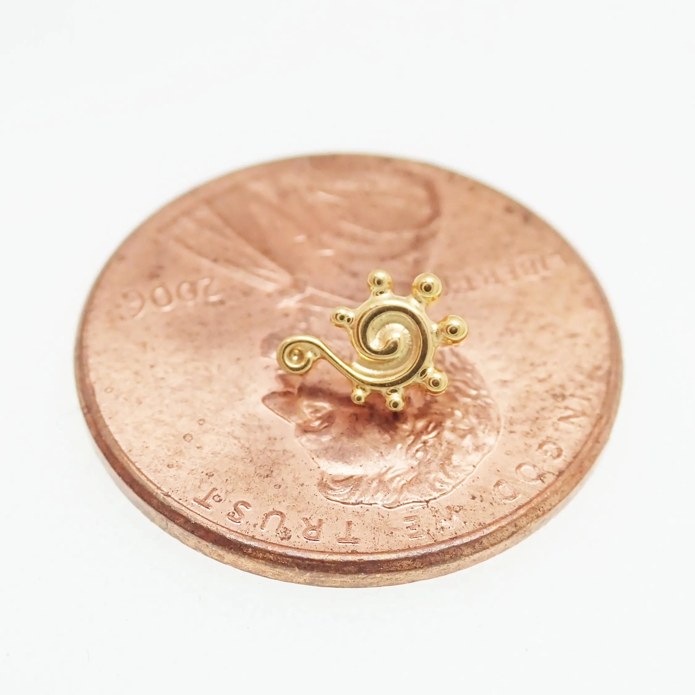 Titanium PVD beaded swirl flatback labret piercing earrings in 14g, 16g, and 18g with a sleek, stylish design.