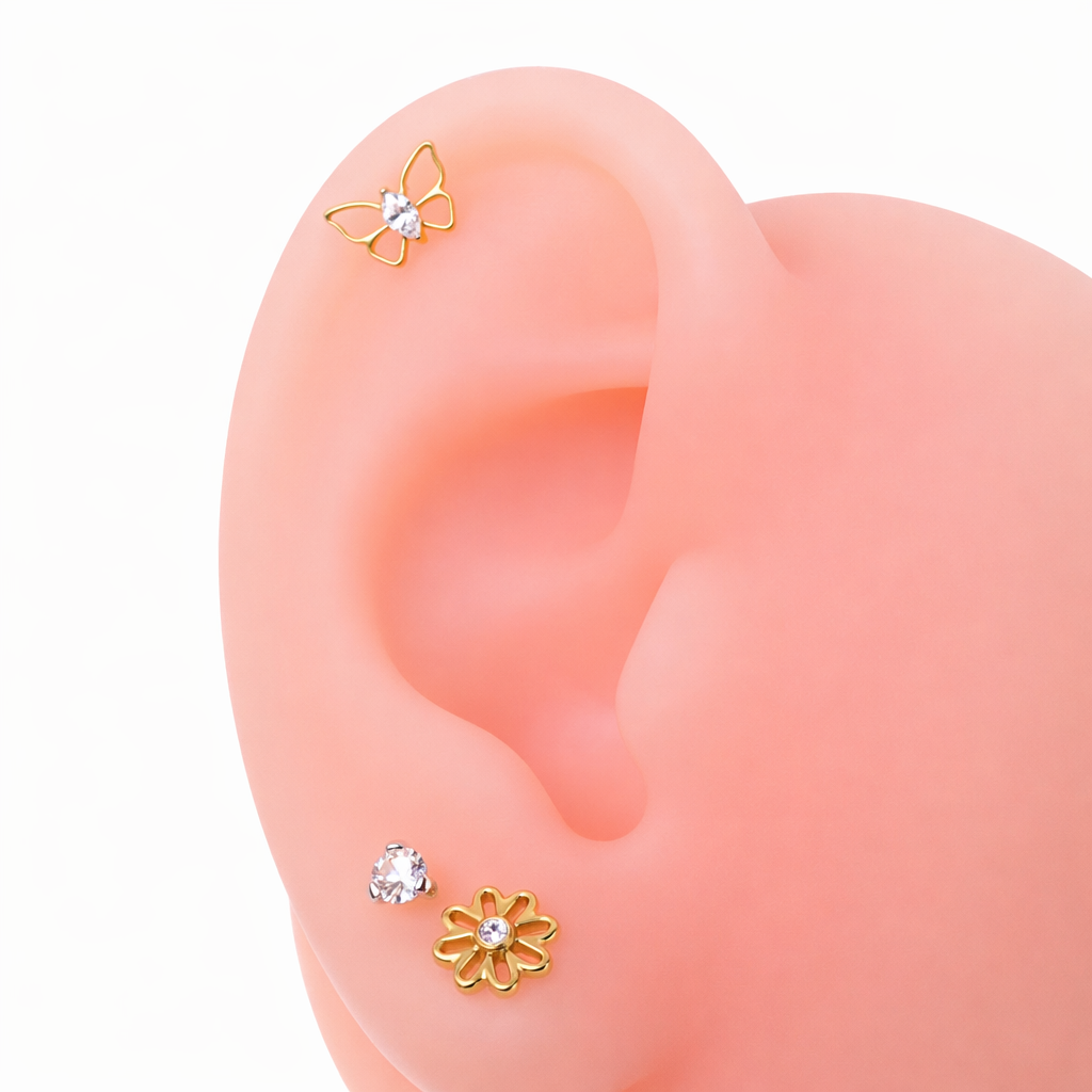 Gold PVD butterfly CZ implant titanium earrings, flatback piercing, internally threaded, available in 14g, 16g, and 18g sizes.