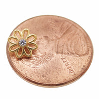Gold flower implant titanium labret piercing with CZ stone, available in 14g, 16g, and 18g sizes, body jewelry by Body Clickers.