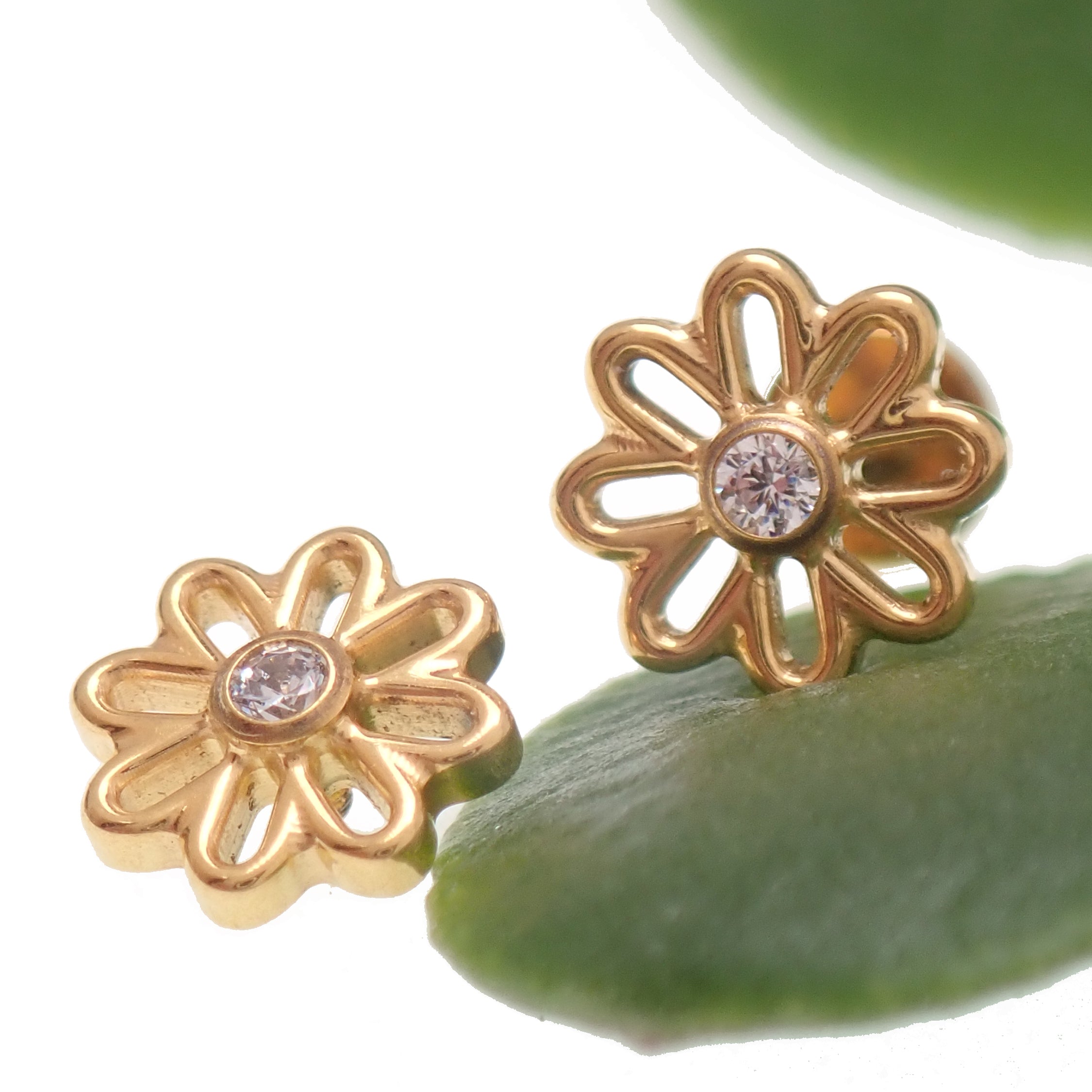 Gold flower implant titanium labret piercing with CZ stone, available in 14g, 16g, and 18g, Body Clickers earrings.