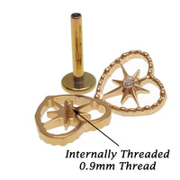 Gold PVD titanium heart starburst flatback earring by Body Clickers, internally threaded implant piercing in 14g, 16g, and 18g sizes.
