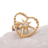 Gold heart and starburst implant titanium PVD flatback piercing earrings in 18g, 16g, and 14g, internally threaded.