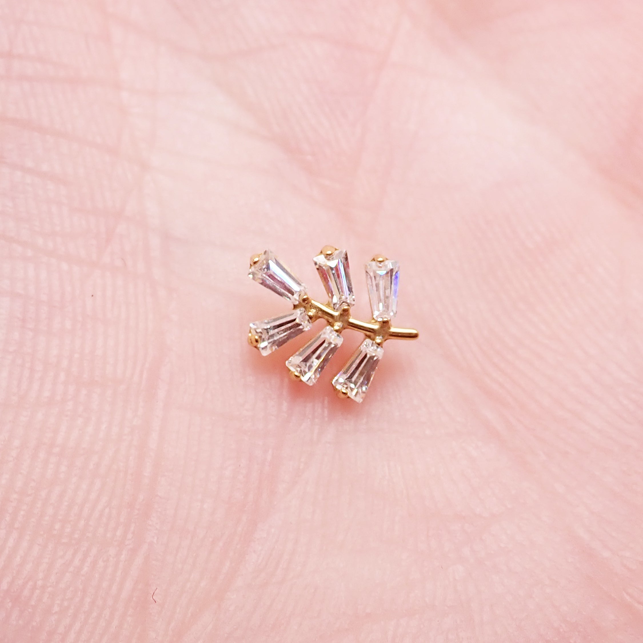 Body Clickers implant titanium PVD vine earrings with CZ stones, flatback labret piercings in 14g, 16g, and 18g.