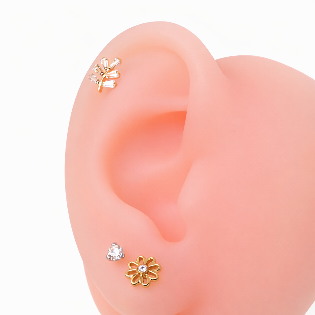Body Clickers implant titanium PVD vine earrings with CZ stones, flatback labret piercing in 14g, 16g, and 18g sizes.