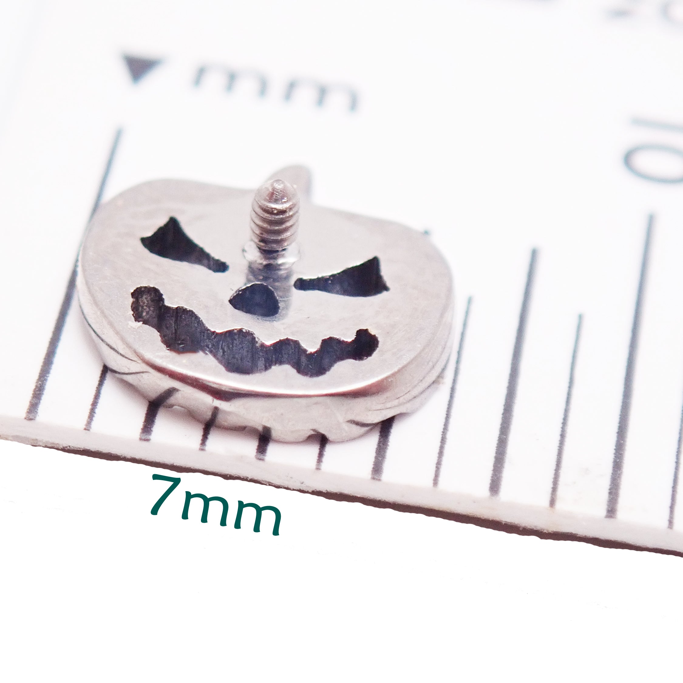 Pumpkin-shaped Titanium flatback piercing earrings in 14g, 16g, and 18g from Body Clickers, suitable for body jewelry.