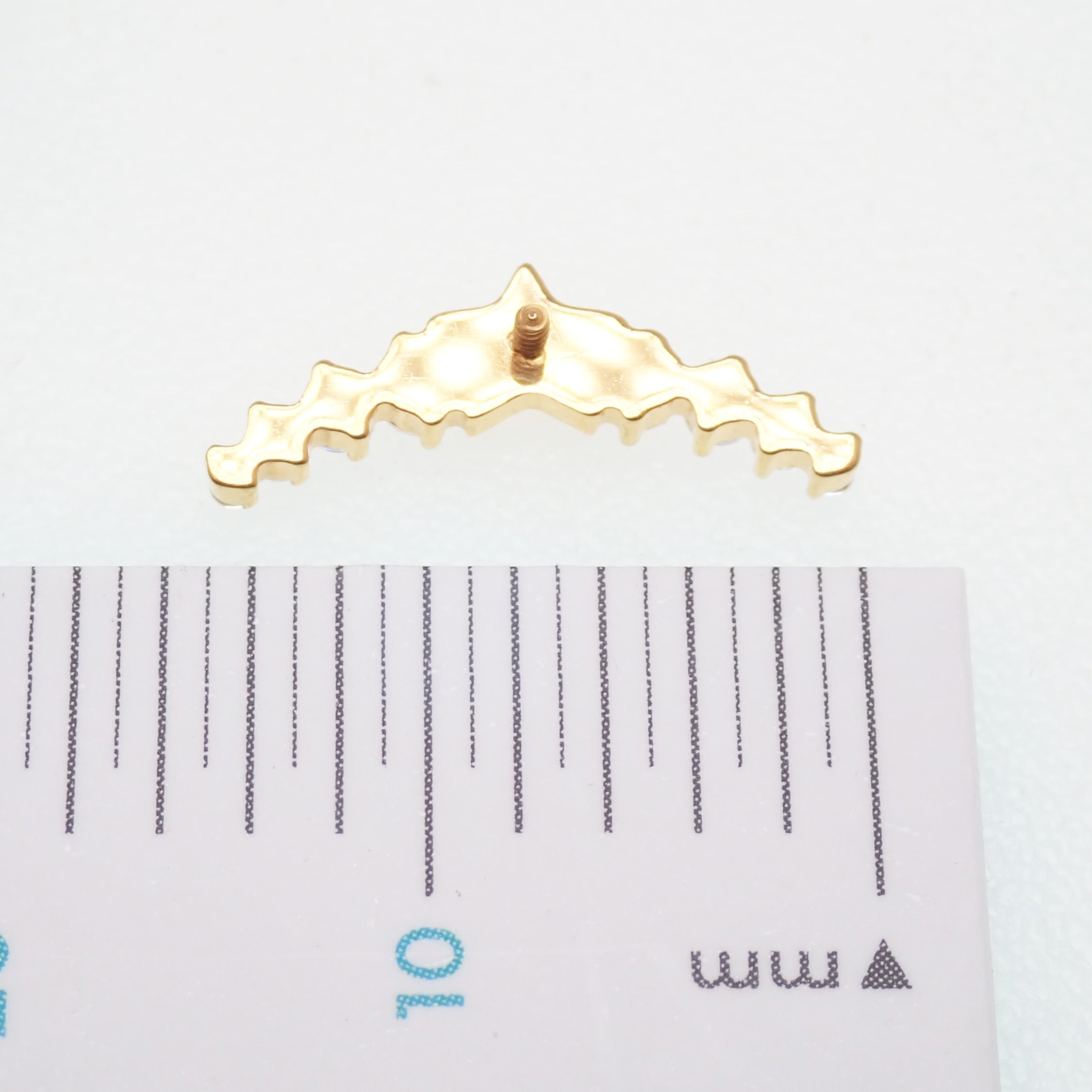 Star CZ helix curve titanium earrings, flatback labret piercing in 14g, 16g, and 18g, from Body Clickers.