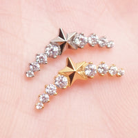 Star CZ helix curve titanium earrings in 14g, 16g, and 18g with flatback labret piercing, featuring sparkling star design.