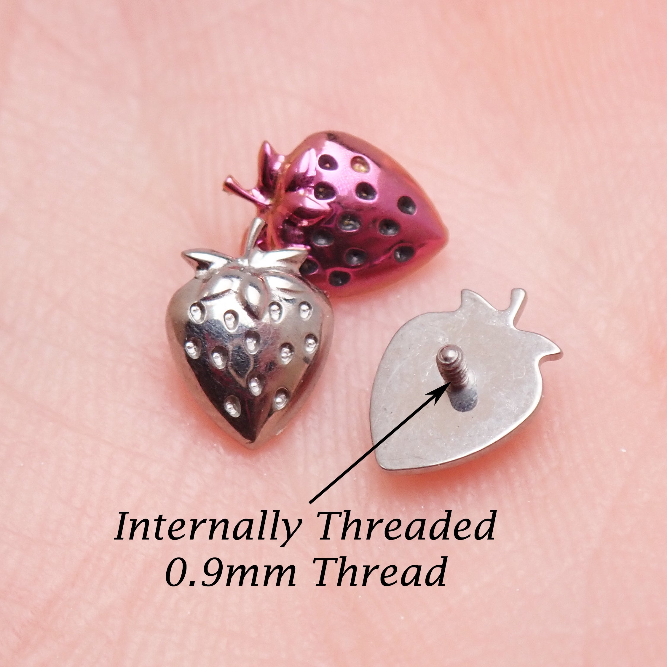 Strawberry titanium flatback labret piercing earrings in 14g, 16g, 18g from Body Clickers with a 6mm diameter.