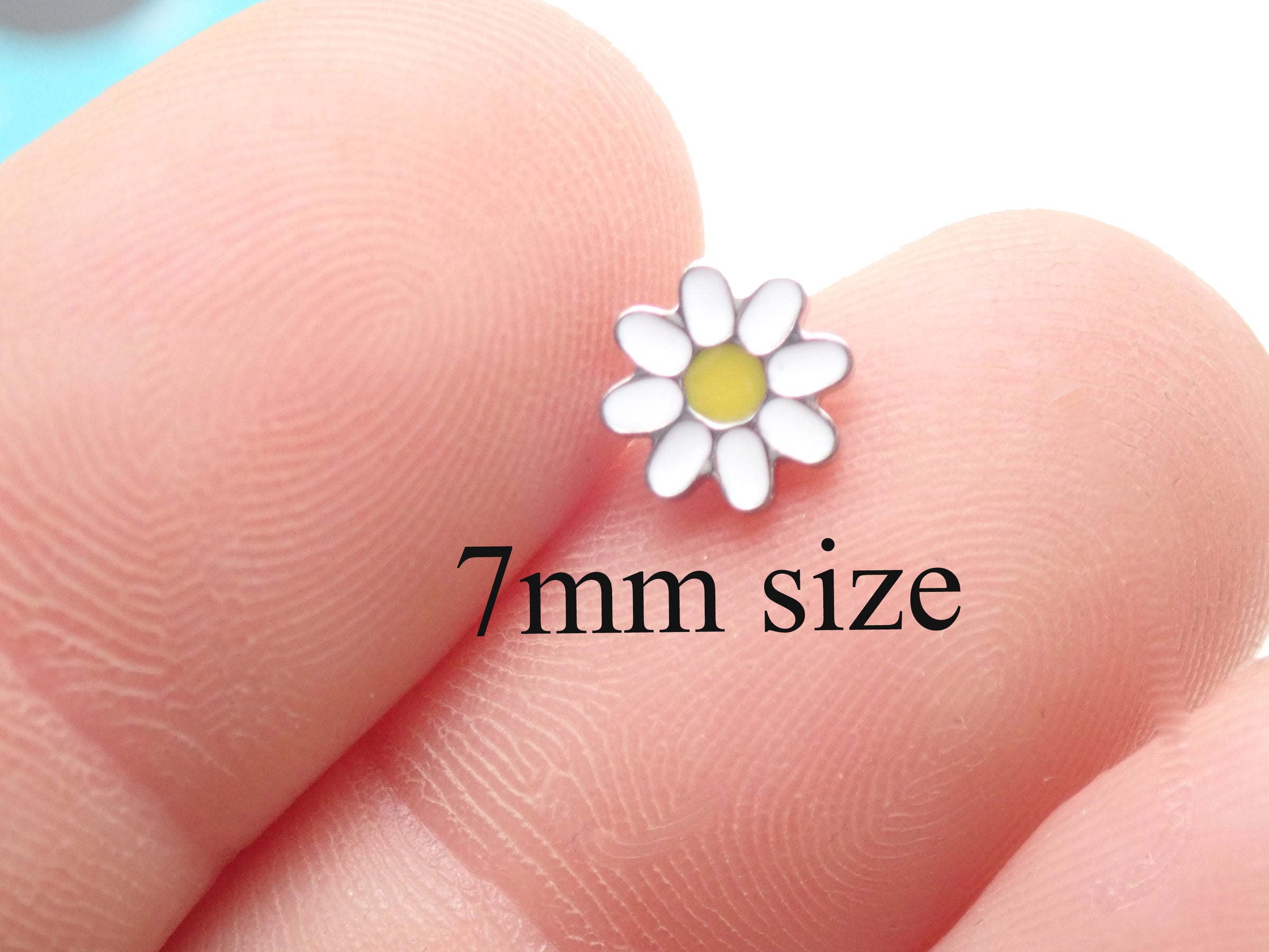 Daisy Fit Titanium Flatback Piercing earrings in 20g, 18g, 16g, 14g sizes, featuring a daisy design, by Body Clickers.