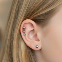 Body Clickers implant titanium flatback earrings in 14g, 16g, 18g, 20g with 3mm and 6mm sizes on white background.