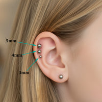 Body Clickers titanium implant earrings with 3mm flatback push fit design in 20g, 18g, 16g, and 14g sizes for ear piercing.