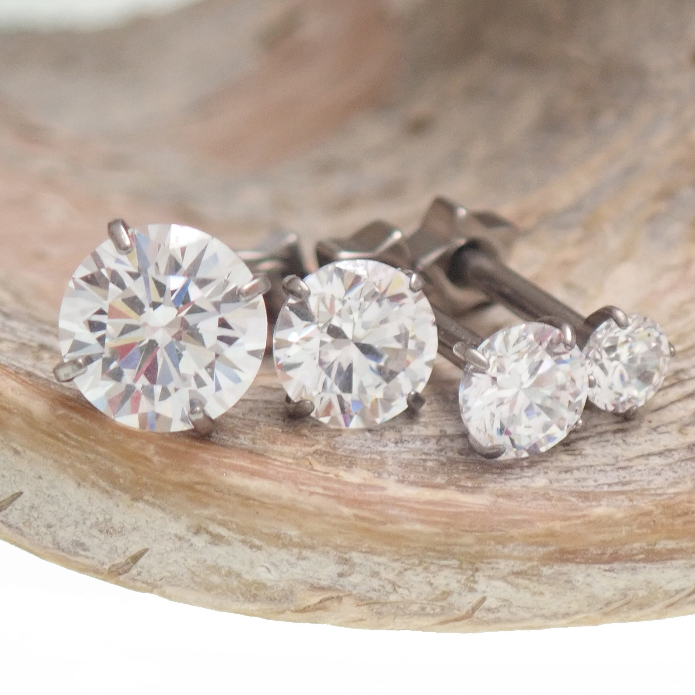 Implant grade titanium set of 4 star back CZ earrings, externally threaded, 16g, 8mm, from Body Clickers.
