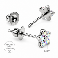 Pair of Body Clickers implant titanium clear CZ flower earrings, 20g, with floral design and transparent stones.