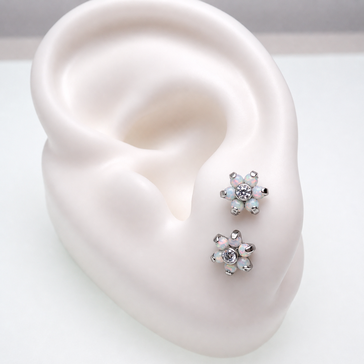 Titanium flower-shaped opal earrings by Body Clickers, 20g implant earrings with vibrant gemstone design.