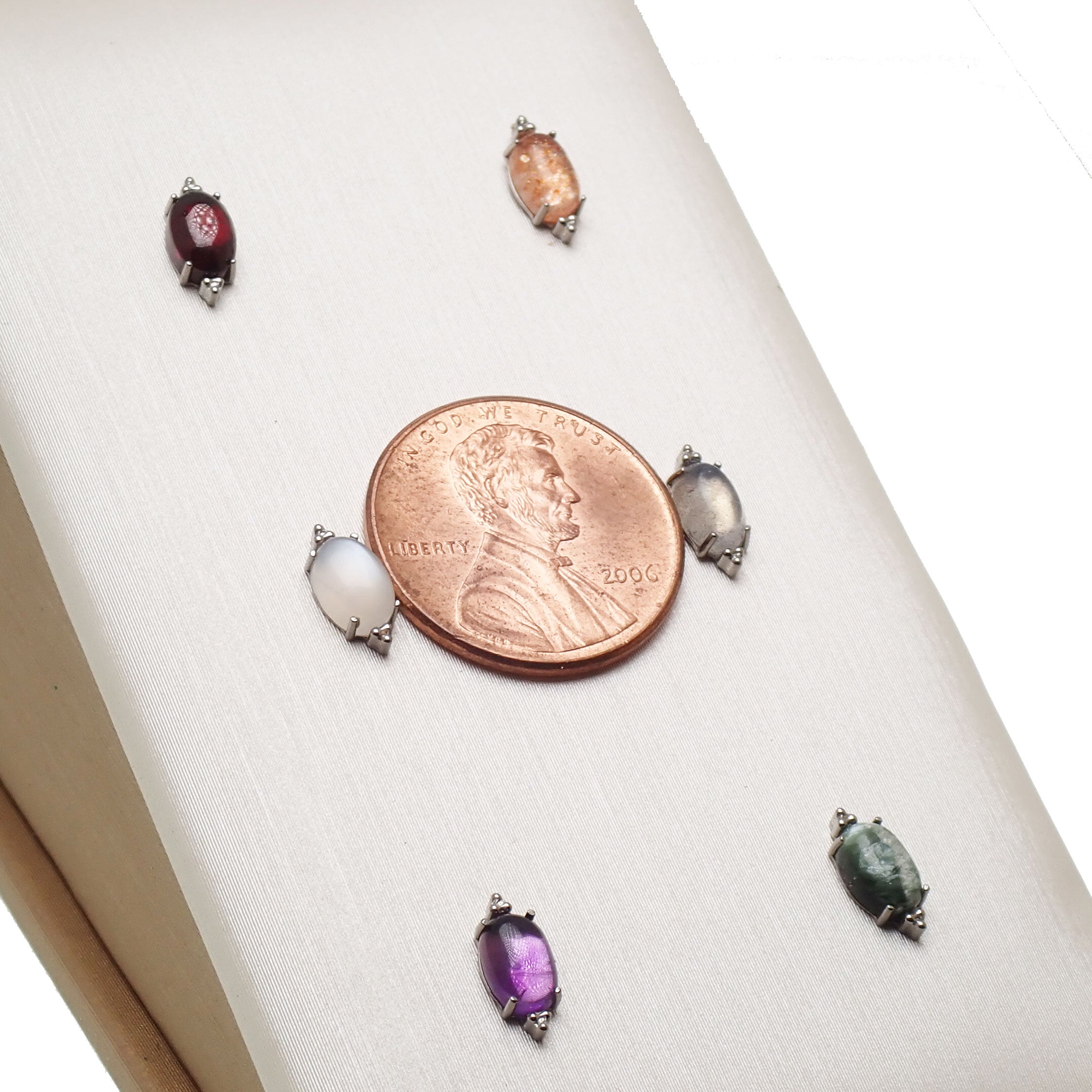 Titanium labret piercing earrings with natural stone oval flatback, available in 14g, 16g, and 18g sizes, by Body Clickers.