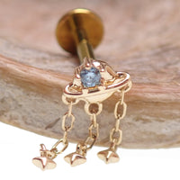 14K gold celestial flatback piercing with a planet design, internally threaded, available in 14g, 16g, and 18g from Body Clickers.