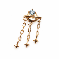 14K gold celestial flatback piercing by Body Clickers, internally threaded in 14g, 16g, and 18g sizes, featuring a planetary design.