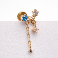 14K gold celestial flatback piercing by Body Clickers, internally threaded in 14g, 16g, and 18g with a sleek celestial design.